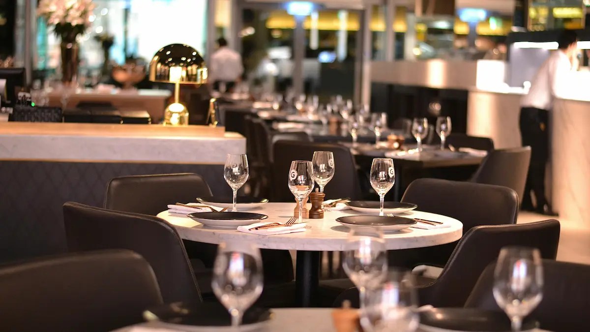 Maitre d' managing reservations on a tablet